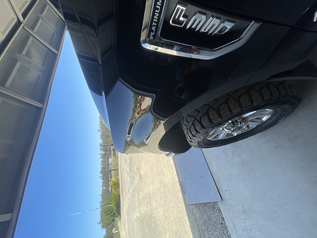 Glossy wax finish on black truck paint